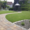 Geschwungener Pflasterweg mit dem Altstadtpflaster durch eine Gartenanlage